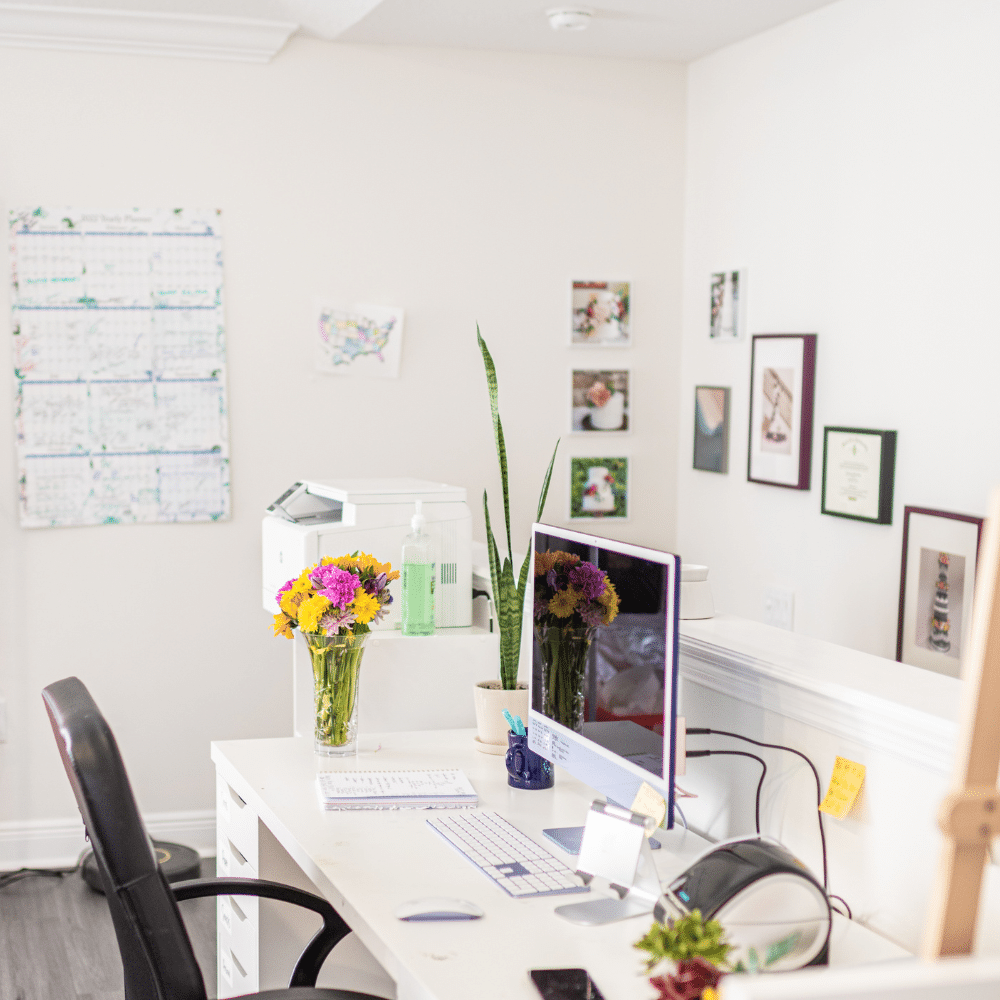 clean and modern art studio and office with apple imac and wall calendar