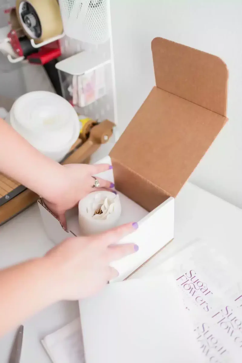 boxing up a sugar flower for shipping