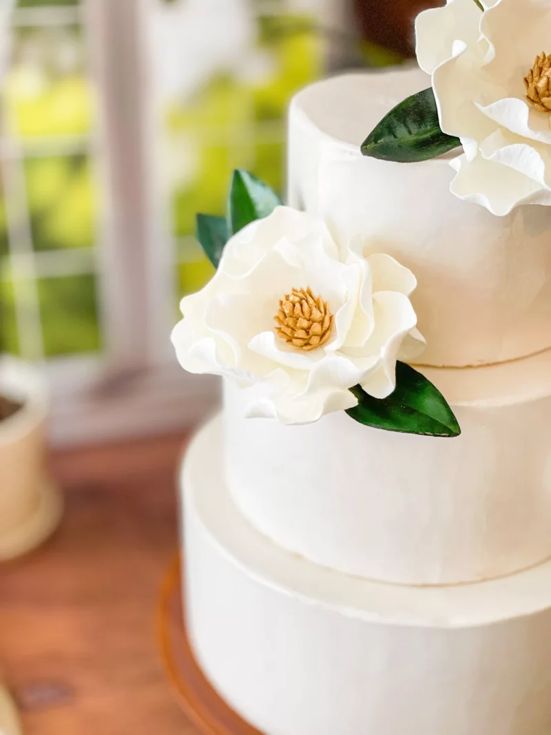 magnolia sugar flowers on a wedding cake