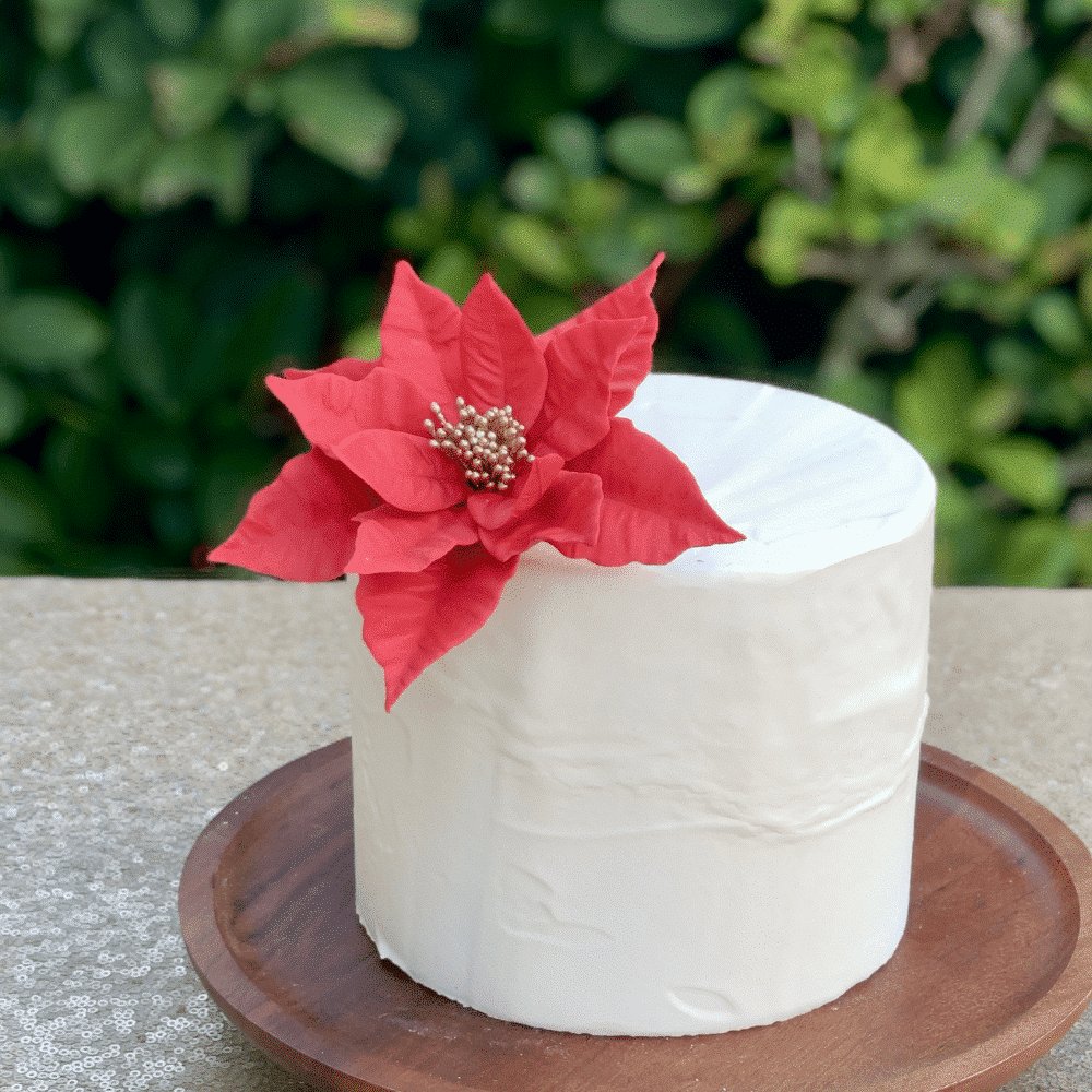 red poinsettia sugar flower for christmas by kelsie cakes