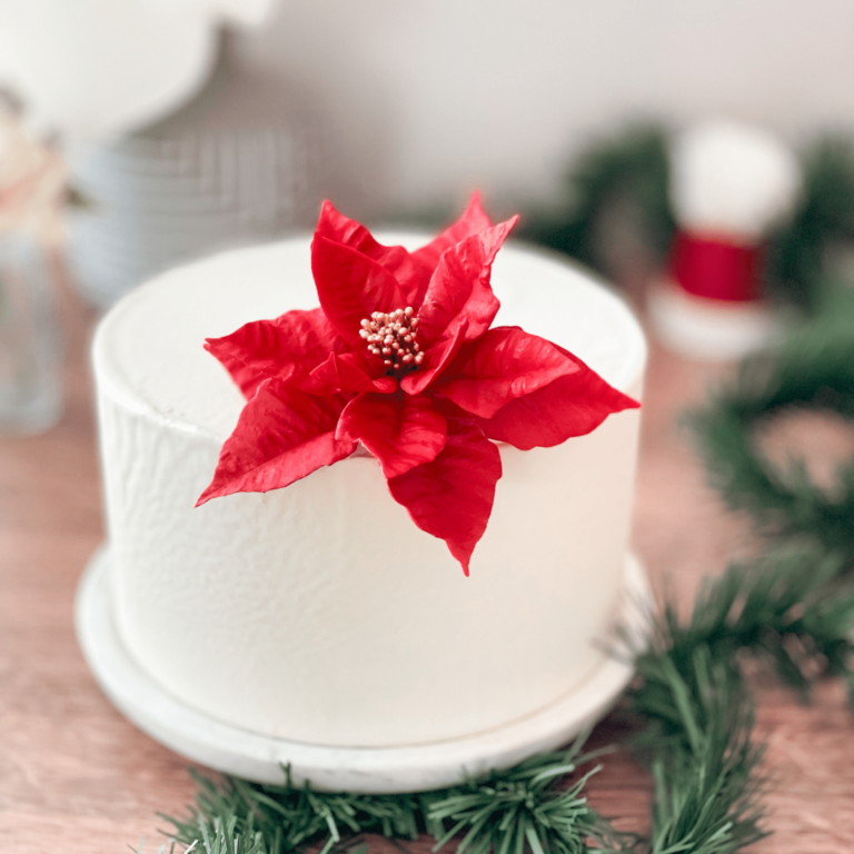 red poinsettia sugar flower for christmas by kelsie cakes