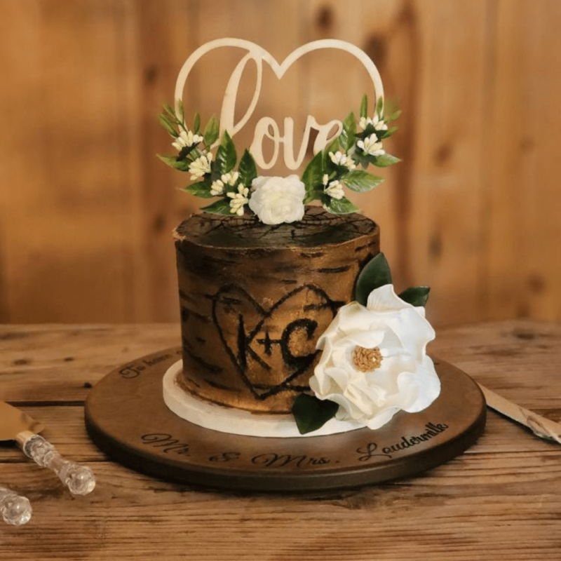 rustic wedding cake with white modern magnolia sugar flower