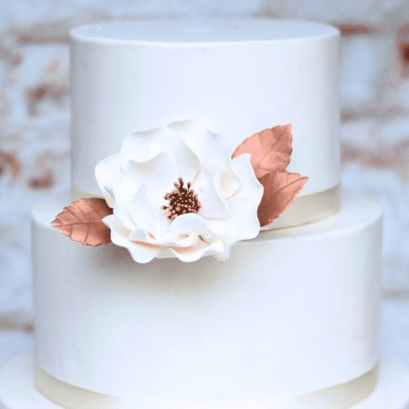 rose gold rose leaves with a white and rose gold open rose sugar flower