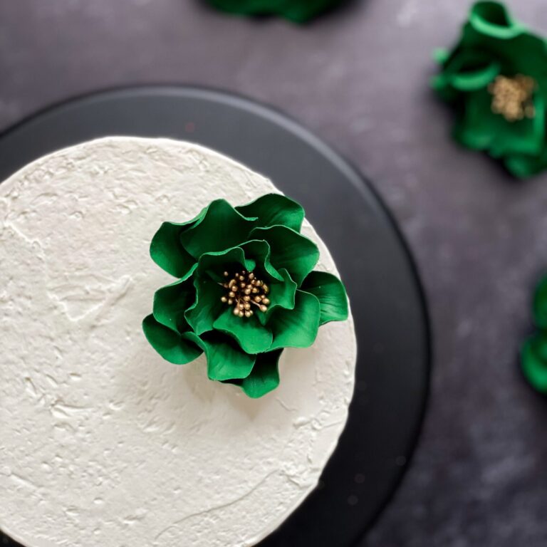 small emerald green and gold open rose sugar flower