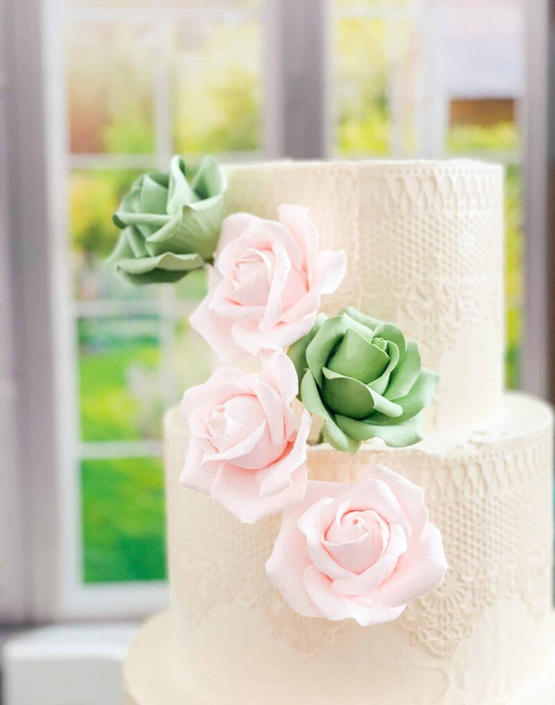 cascade of small blush pink and sage green sugar flower roses